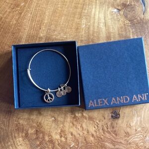 Alex and Ani peace sign charm bracelet in gold